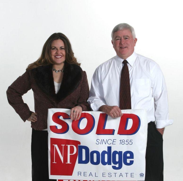 NP Dodge Real Estate Logo